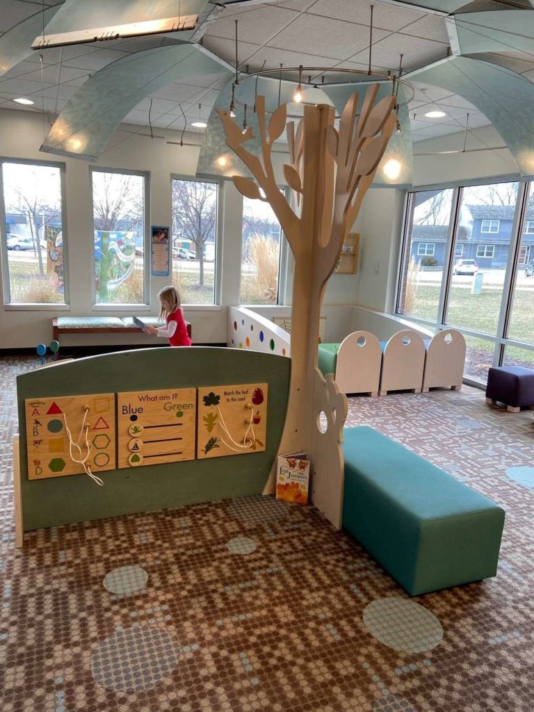 tree, activity panels and seating