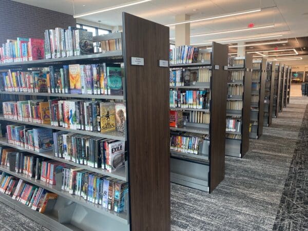 fiction shelving with sloping base shelf and custom end panels