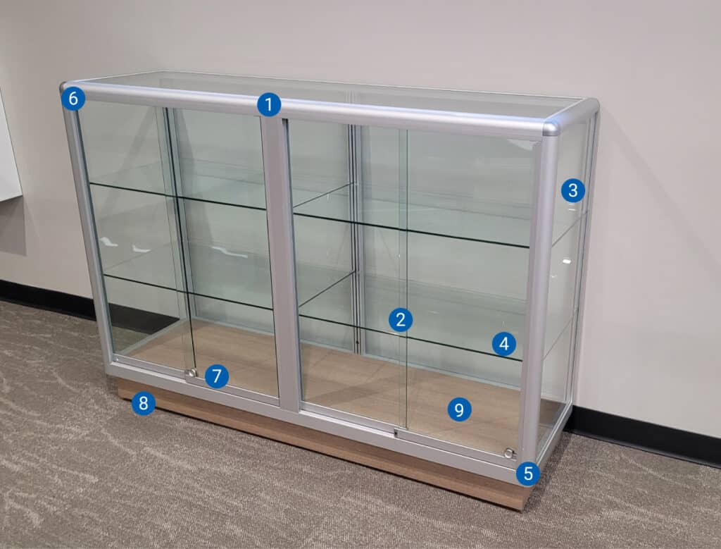glass display case with two shelves and locking sliding doors