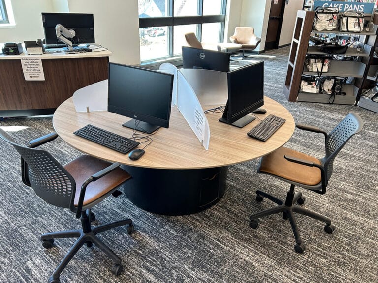 computer station with acrylic dividers and power cord management