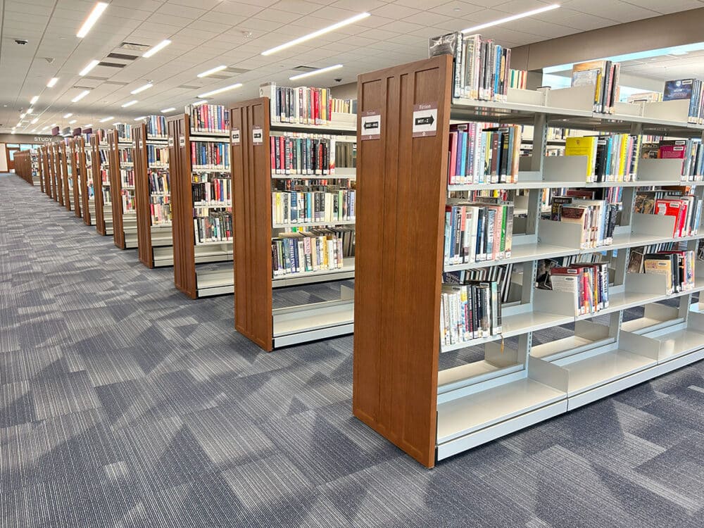 Steel shelving with oak mission-style end panels.