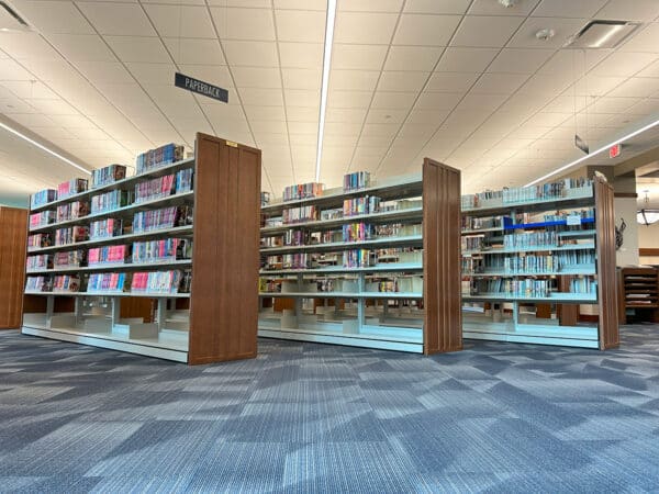 Steel shelving with oak mission-style end panels.